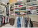 Spacious walk-in closet with custom shelving and ample storage space for clothing and accessories at 14461 Inca Ct, Westminster, CO 80023