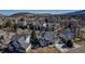 An aerial view showcasing the home and its neighborhood with picturesque mountain views at 69 Dawn Heath Cir, Littleton, CO 80127