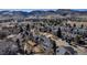 Expansive aerial view of a neighborhood nestled in front of the picturesque Colorado Rocky Mountains at 69 Dawn Heath Cir, Littleton, CO 80127