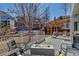 Backyard with a modern fire pit and outdoor seating, perfect for entertaining at 69 Dawn Heath Cir, Littleton, CO 80127