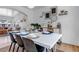 Modern dining room with a white table, contemporary chairs, and stylish decor at 69 Dawn Heath Cir, Littleton, CO 80127