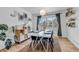 Bright dining room featuring a modern table setting, artwork, and natural light at 69 Dawn Heath Cir, Littleton, CO 80127