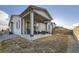 View of a backyard patio with outdoor seating, a grill, and a well-maintained lawn at 18187 E 99Th Ave, Commerce City, CO 80022