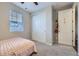 Comfortable bedroom with a large closet, window with blinds, and neutral decor at 18187 E 99Th Ave, Commerce City, CO 80022