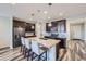 Modern kitchen featuring granite countertops, stainless appliances, and an island with barstool seating at 18187 E 99Th Ave, Commerce City, CO 80022