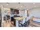 Contemporary kitchen featuring stainless steel appliances, a center island and bar stool seating at 18187 E 99Th Ave, Commerce City, CO 80022