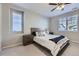 Serene main bedroom with soft carpet, a ceiling fan, and lots of natural light at 18187 E 99Th Ave, Commerce City, CO 80022