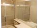 Clean bathroom featuring a shower with glass doors and a neutral color scheme at 19692 E Mann Creek Dr # D, Parker, CO 80134
