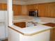 Bright kitchen with modern appliances, ample cabinet space, and breakfast bar at 19692 E Mann Creek Dr # D, Parker, CO 80134