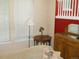 Bright living room featuring large window, table lamp and wooden furniture at 19692 E Mann Creek Dr # D, Parker, CO 80134