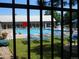 Community pool area featuring lounge chairs and mature trees at 19692 E Mann Creek Dr # D, Parker, CO 80134
