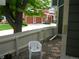 A fenced-in side yard with pea gravel, stepping stones, and a stack of chairs at 19692 E Mann Creek Dr # D, Parker, CO 80134