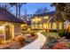 Backyard with a stone walkway, manicured garden and an outdoor seating area at 1160 Monaco Pkwy, Denver, CO 80220