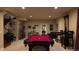 Finished basement featuring a pool table and stairs to upper level at 1160 Monaco Pkwy, Denver, CO 80220