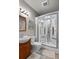 Modern bathroom features an updated vanity and a luxurious enclosed shower at 1160 Monaco Pkwy, Denver, CO 80220