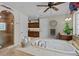 Elegant bathroom with large soaking tub, shower, and a vanity area with granite counters at 1160 Monaco Pkwy, Denver, CO 80220