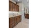 Bathroom vanity with granite countertop, ample storage, and a sink with modern fixtures at 1160 Monaco Pkwy, Denver, CO 80220