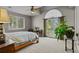 Bright bedroom featuring a ceiling fan, large windows with views and neutral decor at 1160 Monaco Pkwy, Denver, CO 80220