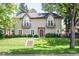 Charming two-story home with manicured lawn and balcony windows at 1160 Monaco Pkwy, Denver, CO 80220