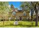 Charming two-story home with a manicured lawn and beautiful architectural details at 1160 Monaco Pkwy, Denver, CO 80220