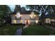 Charming two-story home with landscaped front yard and arched windows at 1160 Monaco Pkwy, Denver, CO 80220