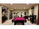 Entertaining game room with a pool table and wet bar at 1160 Monaco Pkwy, Denver, CO 80220