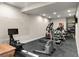 Home gym featuring modern exercise equipment, and rubber flooring at 1160 Monaco Pkwy, Denver, CO 80220