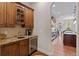 Kitchen featuring wood cabinets, granite countertops, and stainless steel appliances at 1160 Monaco Pkwy, Denver, CO 80220