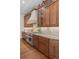 Well-equipped kitchen with custom cabinets, granite countertops, and stainless steel range at 1160 Monaco Pkwy, Denver, CO 80220