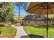 Beautifully landscaped backyard with a stone walkway and manicured garden beds at 1160 Monaco Pkwy, Denver, CO 80220
