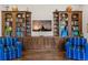 Living room featuring custom built-in shelving units flanking media center and plush seating at 1160 Monaco Pkwy, Denver, CO 80220