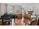 Elegant living room featuring a fireplace, hardwood floors, and natural light at 1160 Monaco Pkwy, Denver, CO 80220
