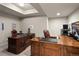 Spacious home office with custom wood desks and comfortable leather chairs at 1160 Monaco Pkwy, Denver, CO 80220