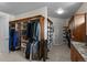 Well-organized walk-in closet with custom shelves, storage, and plenty of space for clothing at 1160 Monaco Pkwy, Denver, CO 80220