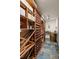 Elegant wine cellar with custom racking, slate tile flooring, and storage at 1160 Monaco Pkwy, Denver, CO 80220