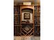 Detailed wine cellar showcases custom built-in racks and shelving at 1160 Monaco Pkwy, Denver, CO 80220