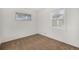 This room is bright with two windows and has white walls with carpeted floors at 5661 E Amherst Ave, Denver, CO 80222