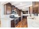 Modern kitchen with stainless steel appliances, white marble countertops, and ample cabinet space at 5661 E Amherst Ave, Denver, CO 80222