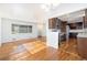 Open floor plan showcasing hardwood floors, natural light, and seamless flow into the modern kitchen at 5661 E Amherst Ave, Denver, CO 80222