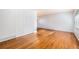 Bright living room featuring gleaming hardwood floors, fresh paint, and large windows at 5661 E Amherst Ave, Denver, CO 80222