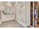 Contemporary bathroom boasting a glass shower, white tile, vanity, and sauna at 6058 Beeler Ct, Denver, CO 80238