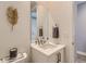 Elegant bathroom featuring a modern vanity, sleek mirror, and stylish decorative accents at 6058 Beeler Ct, Denver, CO 80238