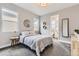 Inviting bedroom with soft carpet, a cozy bed, and ensuite bathroom, bathed in natural light at 6058 Beeler Ct, Denver, CO 80238