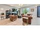 Bright living room featuring hardwood floors, chesterfield sofas, and lots of light at 6058 Beeler Ct, Denver, CO 80238