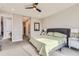 Bright main bedroom featuring a comfortable bed, stylish nightstands, and neutral decor at 6058 Beeler Ct, Denver, CO 80238