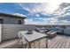 Spacious rooftop patio with comfortable seating, fire pit, and dining table at 6058 Beeler Ct, Denver, CO 80238