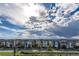 Street view showcasing modern home exteriors in a well-maintained neighborhood with mountain views at 6058 Beeler Ct, Denver, CO 80238