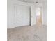 A carpeted bedroom offers a closet with open doors for additional storage space at 28610 E 8Th Pl, Watkins, CO 80137