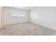 Bright bedroom with a neutral carpet, and a window with blinds at 28610 E 8Th Pl, Watkins, CO 80137