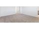 Bedroom with a neutral carpet and white walls at 28610 E 8Th Pl, Watkins, CO 80137